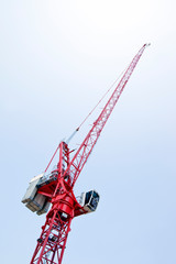 Close-up view of a red crane against sky