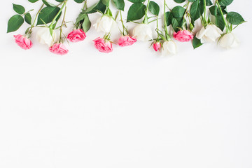 Flowers composition. Border made of fresh rose flowers. Flat lay, top view