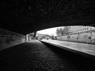 PARIS, FRANCE – MARCH 4TH 2017: A monochrome photograph of the banks of the River Seine, Paris...