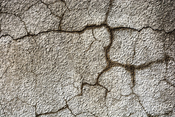 Decorative coating with cracks on the wall