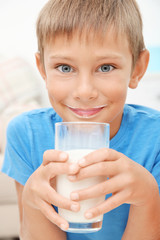 Portrait of little boy with glass of milk