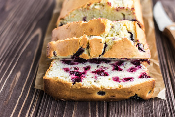 Homemade berry cake on rustic wooden background