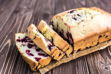 Homemade berry cake on rustic wooden background