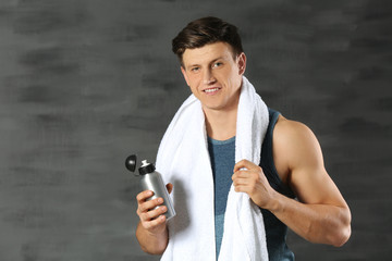 Young handsome sportsman on color background © Africa Studio