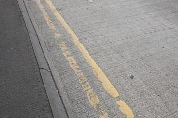 Fototapeta premium Close-Up of double yellow line on road