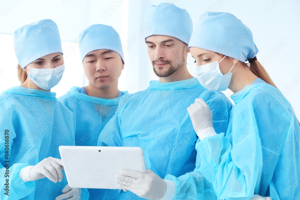 Canvas Prints Young doctors with tablet computer in clinic