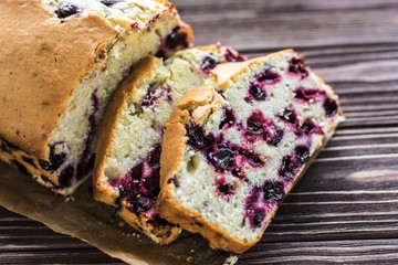 Homemade berry cake on rustic wooden background
