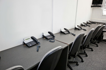 Chairs and landline telephones in television station