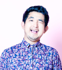 Young Geeky Asian Man in colorful shirt 