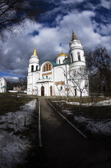 Fototapeta na wymiar The Transfiguration Cathedral in Chernigiv in the spring day, cloudy sky photo shoot with fisheye lens, March, Ukraine