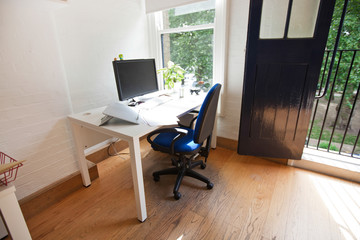 Interior of office with computer on desk