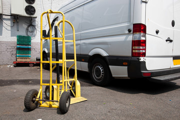 Trolley and van outside warehouse