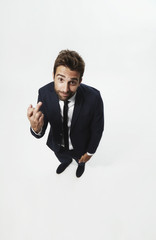 Businessman giving the finger to camera, portrait