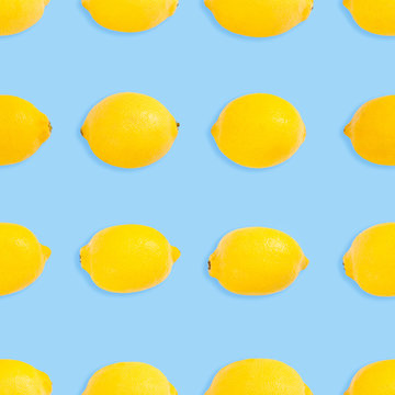 Seamless bright blue background with yellow lemons