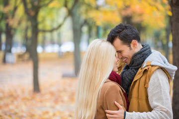 Fototapeta premium Loving couple hugging in park