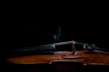 Violin detail with black background