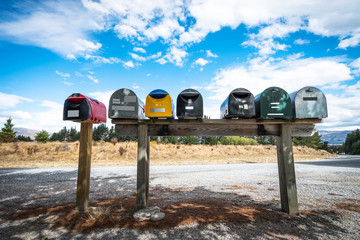 colorful post boxes near road