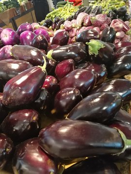 Fresh vegetables on market stall: aubergines
