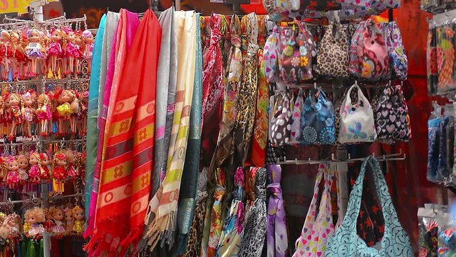 Clothes, bags, souvenirs and toys sale at a street vendor's stall in Singapore