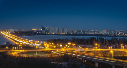 Fototapeta na wymiar North Bridge and traffic roundabout in Voronezh, night cityscape aerial view fro