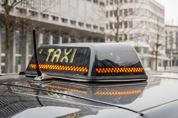 BRUSSELS, BELGIUM. January 25, 2017. Black and white taxi sign on the top of the roof of the taxi cab somewhere in Brussels.