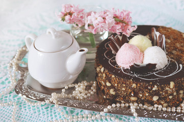 Holiday meal concept. Sweet chocolate cake with peanuts and shredded coconut flakes.