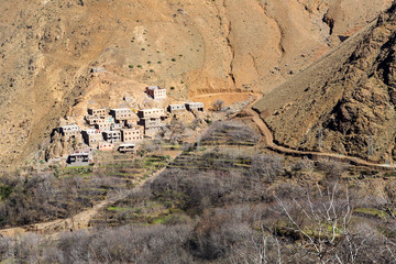 Fototapeta na wymiar Modest traditional berber village with cubic houses in Atlas mountains, Morocco