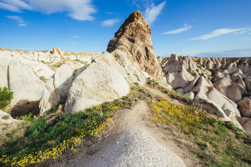 Beautiful Cappadocia on the background of blue sky with white cl