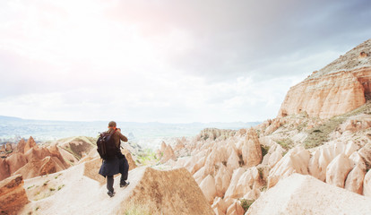 Photographer sandstone cliff and observing the natural landscape