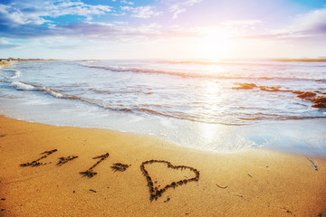 Child picture drawn in the sand on the atlantic coast