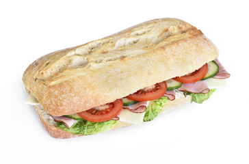 Delicious ciabatta sandwich with ham, tomatoes, fresh salad and cucumber slices. Isolated on white background.