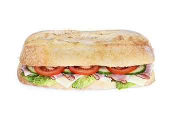 Delicious ciabatta sandwich with ham, tomatoes, fresh salad and cucumber slices. Isolated on white background.