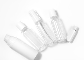 White cosmetic bottles on white background. Wellness, spa and body care bottles collection. Beauty treatment