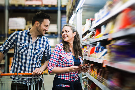 Couple Shopping In Grocery Store