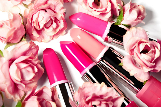 Spring set of lipsticks in pink flowers. Beauty cosmetic collection. Fashion trends in cosmetics, bright lips