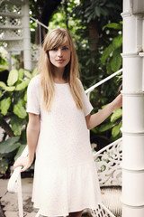 White dress beauty with blond hair, portrait