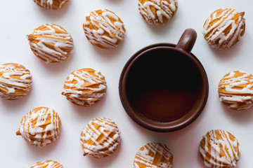 custard cookies with icing for tea with a cup