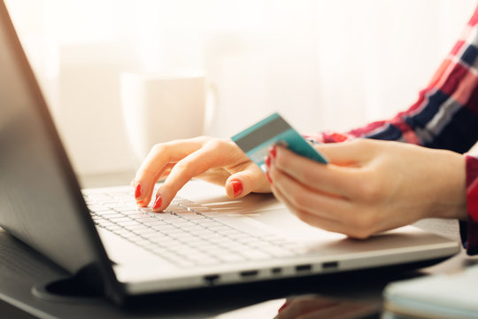 woman making online payment with credit card