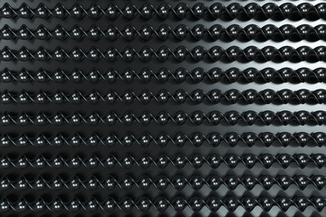 Black plastic spiral sticks on black background