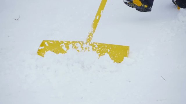 shoveling snow shovel on the slopes slow motion