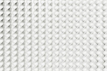 White plastic spiral sticks on white background