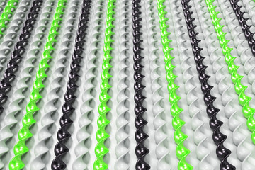 Black, white and green plastic spiral sticks on white background
