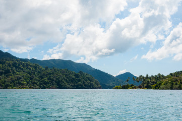 Coast line of green rainforest island in Thailand