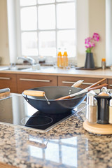 Cooking utensils on stove in kitchen