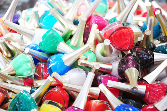 Group of bright nail polishes isolated on white