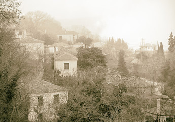 Fog above traditional houses in Milies village on mountain Pelion.Greece