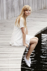 Smiling young blond woman, portrait