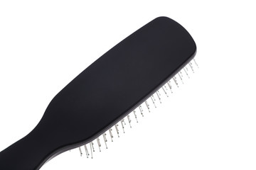Black hair brush isolated closeup 