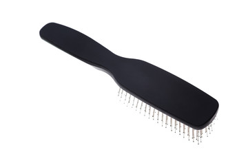 Black hair brush isolated closeup 