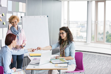 Businesswomen working together in creative office